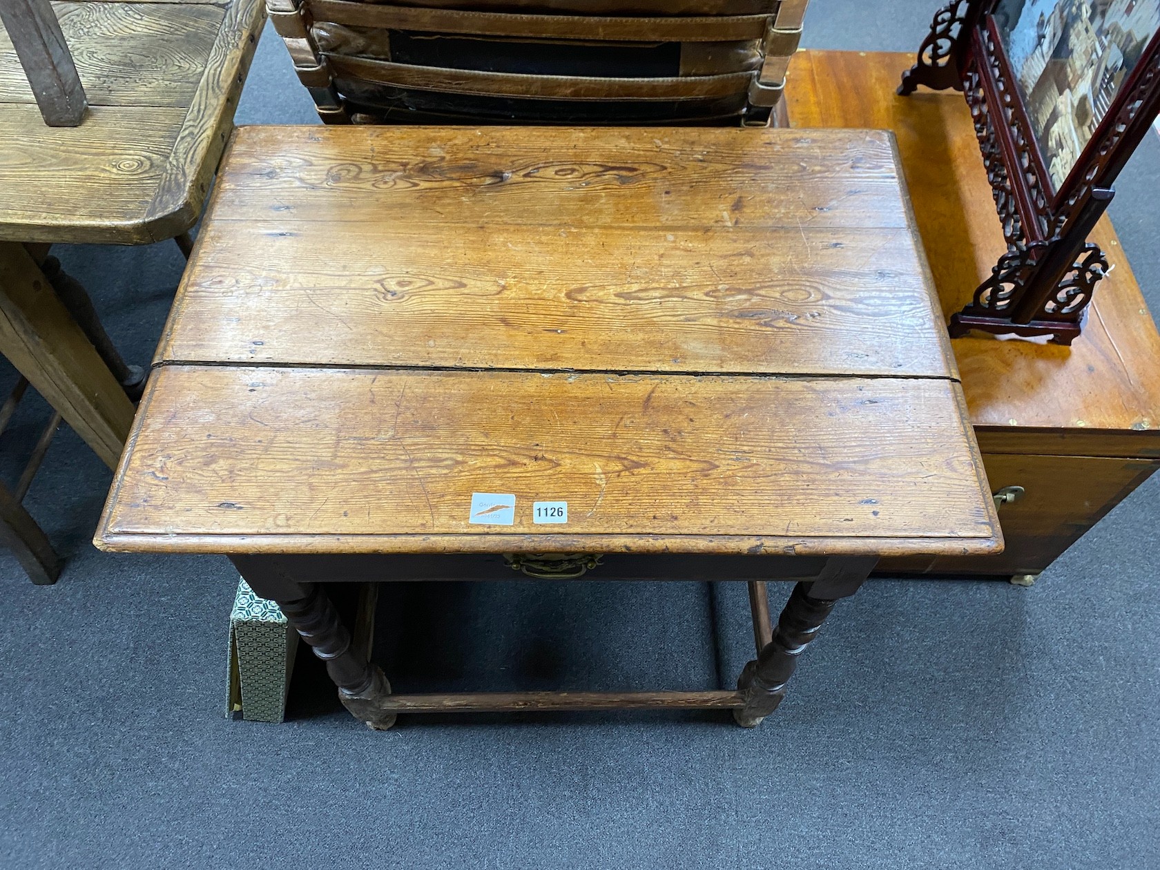 An early 18th century pine topped side table, fitted with a drawer, width 84cm, depth 59cm, height 74cm